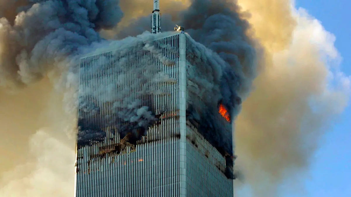 Fire and smoke billows from the north tower of New York's World Trade Center on Tuesday, Sept. 11, 2001. (AP Photo/David Karp)