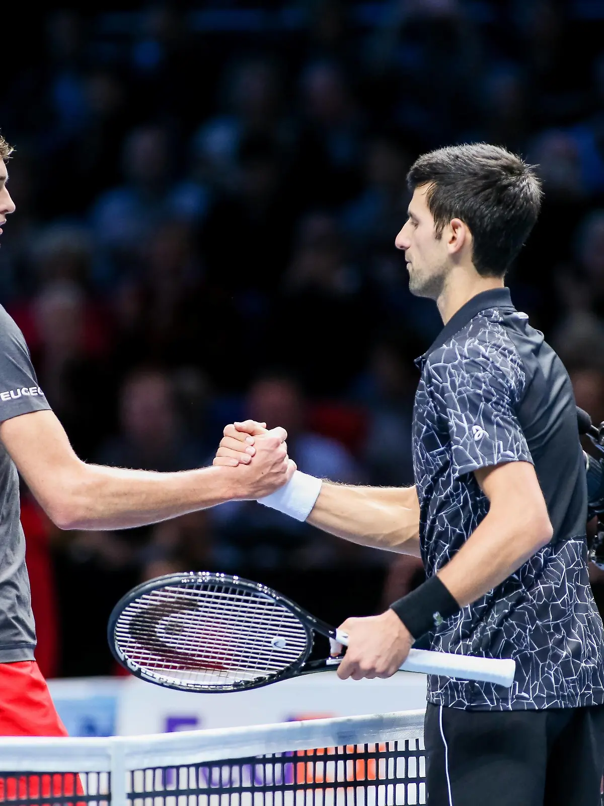 Novak Djokovic of Serbia and Alexander Zverev of Germany greet each other after the men s singles match of the 2018 Nitto ATP Tennis Herren Finals at the O2 Arena in London, England on November 14, 2018. PUBLICATIONxINxGERxSUIxAUTxHUNxONLY (20181114_MMO_4208)  