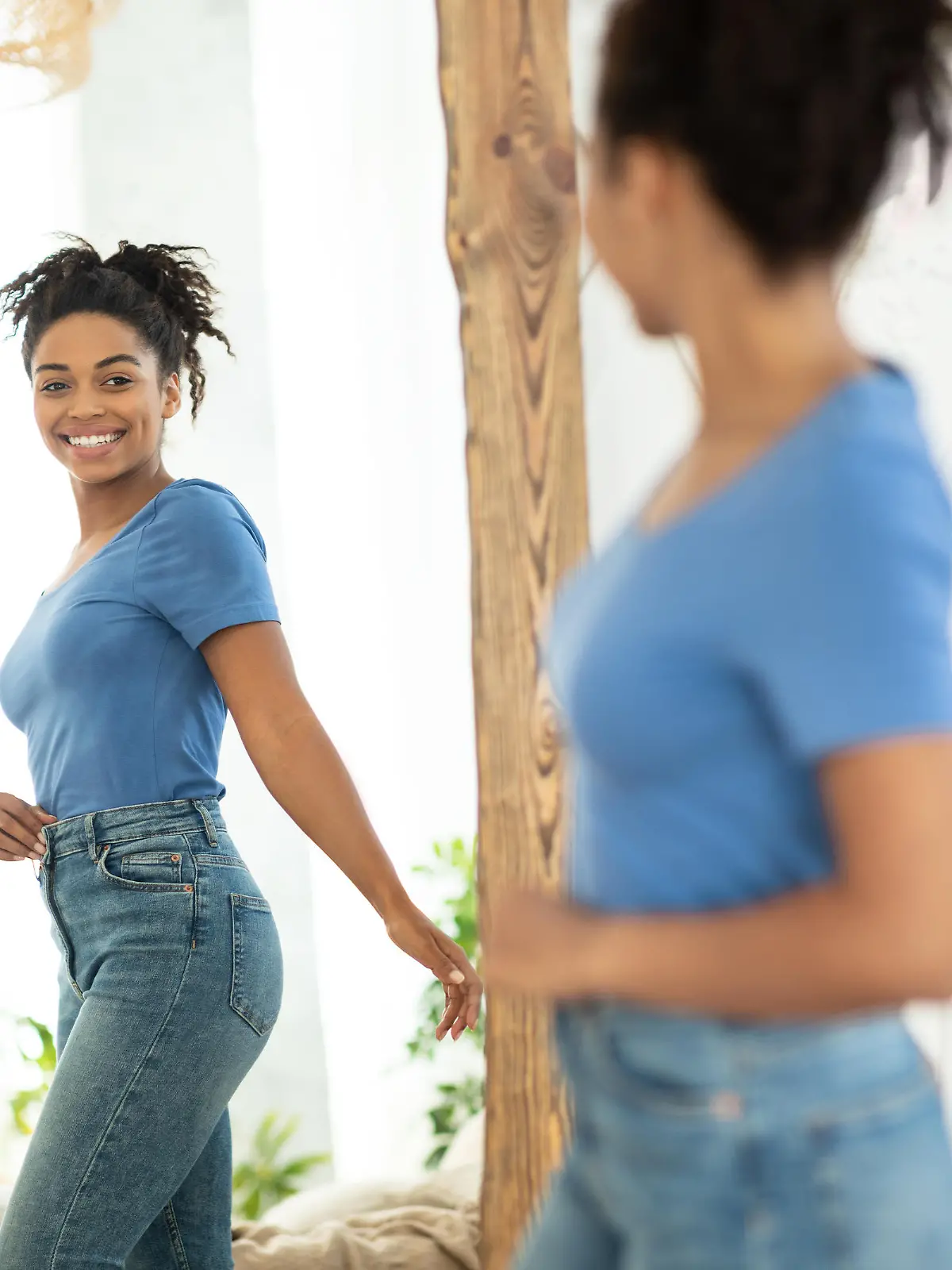 Successful Weight Loss. Joyful African American Girl After Slimming Smiling To Her Reflection In Mirror Standing At Home. Staying Fit, Dieting And Weight-Loss Concept. Selective Focus