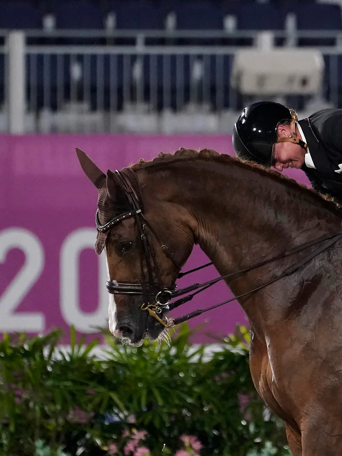 Germany's Isabell Werth, pats her horse, Bella Rose 2, after competing in the equestrian dressage individual final at the 2020 Summer Olympics, Wednesday, July 28, 2021, in Tokyo. (AP Photo/David Goldman)