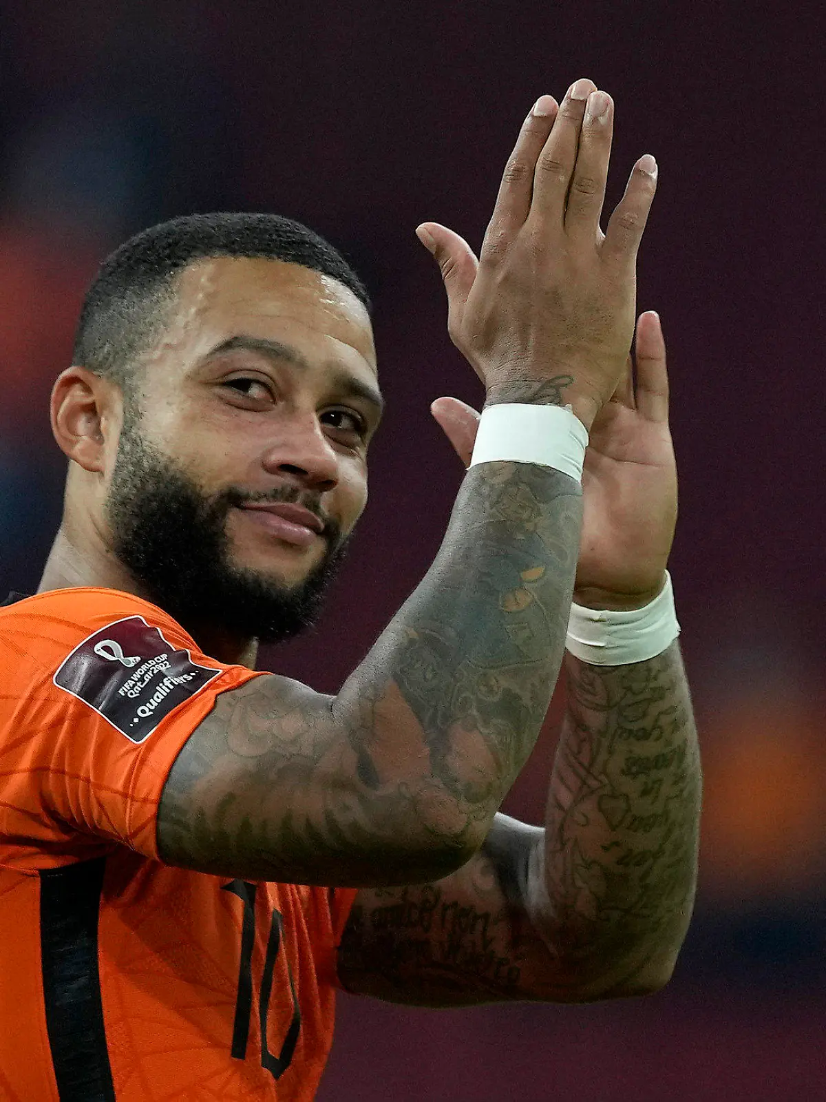 Memphis Depay of the Netherlands applauds to fans after his team won the World Cup 2022 group G qualifying soccer match between the Netherlands and Turkey at the Johan Cruyff Arena in Amsterdam, Netherlands, Tuesday, Sept. 7, 2021. (AP Photo/Peter Dejong)