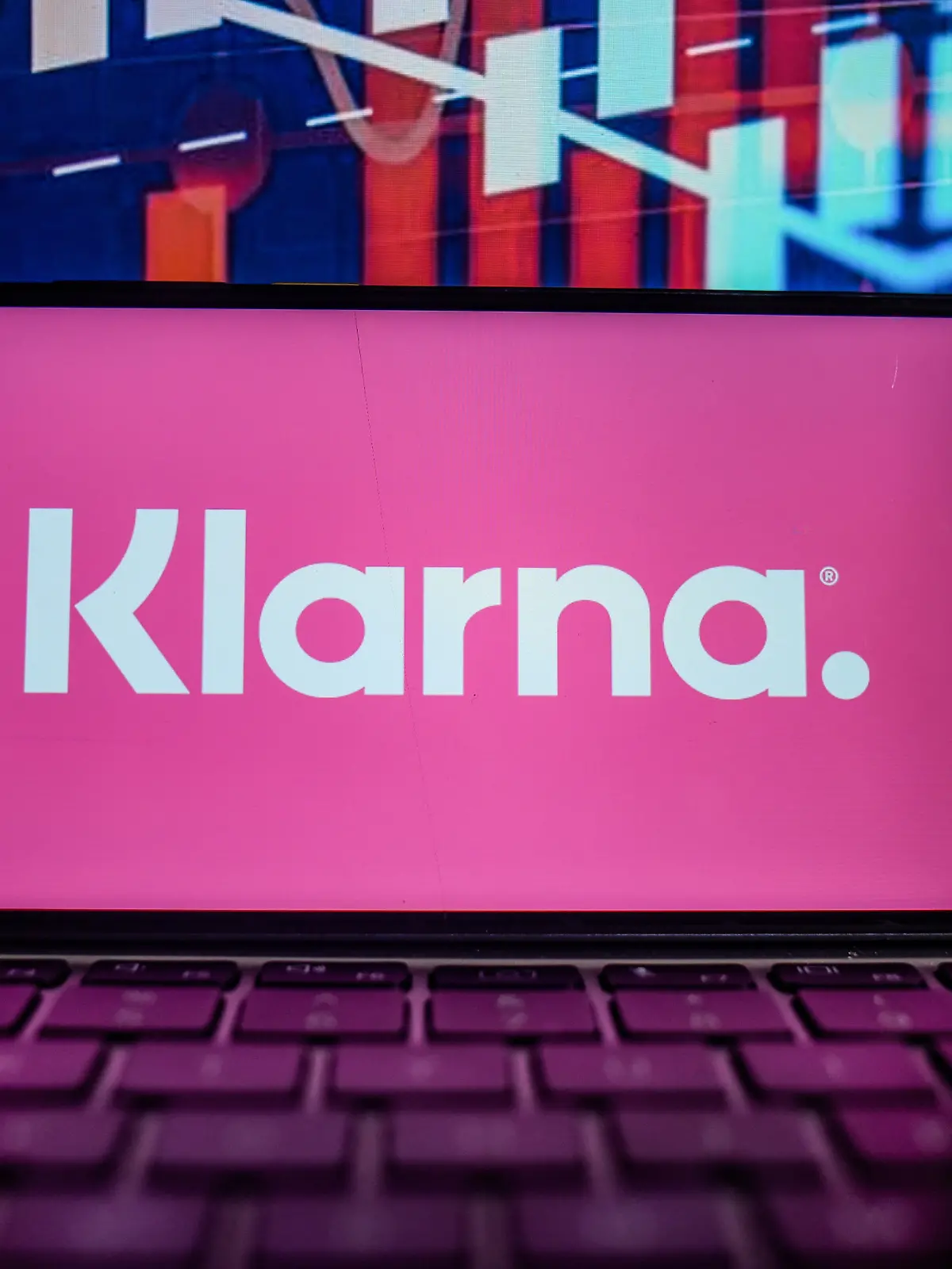 August 25, 2021, Portugal: In this photo illustration a Klarna logo is seen displayed on a smartphone with the stock market percentages in the background. (Credit Image: © Omar Marques/SOPA Images via ZUMA Press Wire