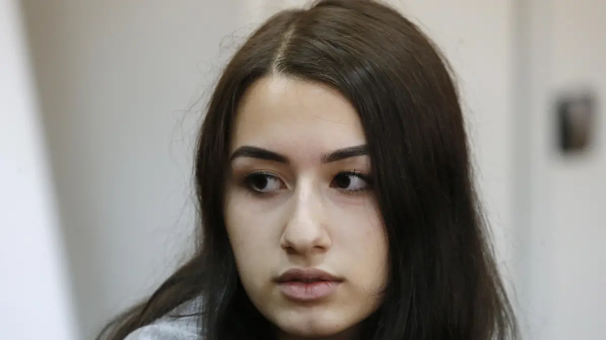 MOSCOW, RUSSIA - JUNE 26, 2019: Krestina, one of the three Khachaturyan teen sisters charged with their father's murder, attends a hearing at Moscow's Basmanny District Court, a motion filed to extend their house arrest. Mikhail Khachaturyan, 57, was killed by his three daughters Maria, Angelina and Krestina, 17, 18 and 19 respectively, in their flat on July 27, 2018. Sergei Karpukhin/TASS