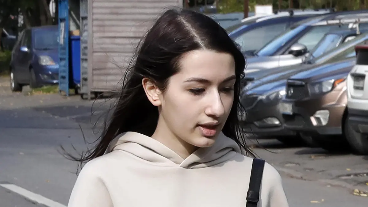 MOSCOW, RUSSIA - SEPTEMBER 22, 2020: Maria Khachaturyan, the youngest of the Khachaturyan sisters who are charged with the murder of their father, arrives for a hearing at Moscow's Butyrsky District Court. The court considers the case of Maria Khachaturyan separately because she was a minor at the time of the alleged crime. Three sisters, Krestina Khachaturyan, Angelina Khachaturyan, and Maria Khachaturyan, were detained over suspected premeditated murder of their father by conspiracy in 2018. The three sisters have claimed that they were mistreated and sexually abused by their father. Mikhail Japaridze/TASS