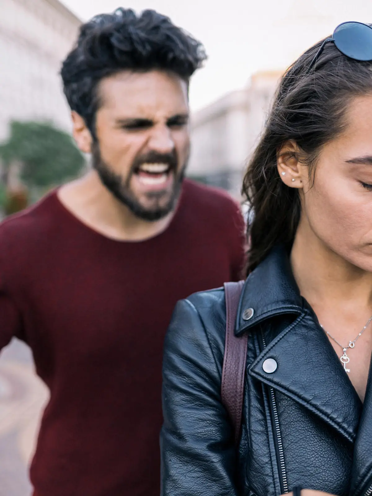 Bearded man shouting at his girlfriend