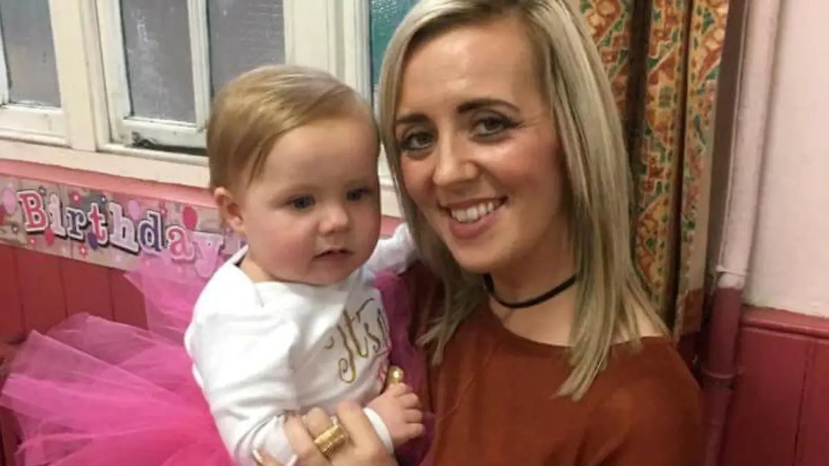 Mum Kayley Newbold with her daughter Honey Rose who has just celebrated her first birthday after defying medics who warned her parents she would probably die within hours of being born. See SWNS story SWHOSPICE; Meet a real festive miracle - a baby fought back to survive a risky Boxing Day heart op despite being sent to a hospice to die. Parents Kayley Newbold, 31, and Gary Clark, 34, were told Honey-Rose might only have hours to live after she was diagnosed with a life-threatening condition in the womb. But rather than the blue-skinned baby struggling to breathe that she was warned to expect, Honey-Rose was born pink and healthy-looking, and began to feed after she was born on December 19, 2016. However, the couple were told she would need hospice care - but as they sat beside her cot, they decided to fight for giving their daughter a chance at life and sought a second opinion.