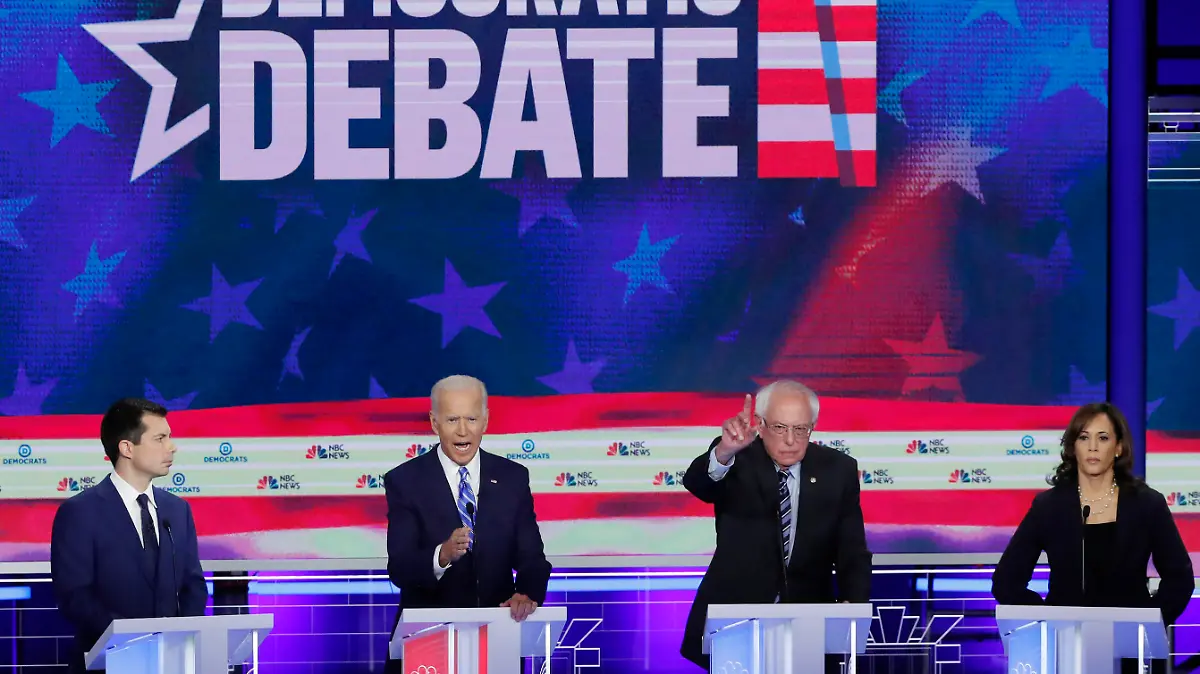 South Bend Mayor Pete Buttigieg, former Vice President Joe Biden, Senator Bernie Sanders and Senator Kamala Harris debate during the second night of the first Democratic presidential candidates debate in Miami, Florida, U.S. June 27, 2019. REUTERS/Mike Segar