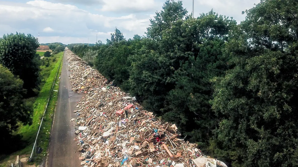 An arm of a disused motorway near Liege collects mountains of waste from the floods of mid-July. Mountains of waste are piling up disproportionately in all the valleys affected by the centenary floods of 14 and 15 July 2021 in the Liege region, Belgium, on August 28, 2021. Photo by Philippe Bourguet/ BePress/ABACAPRESS.COM