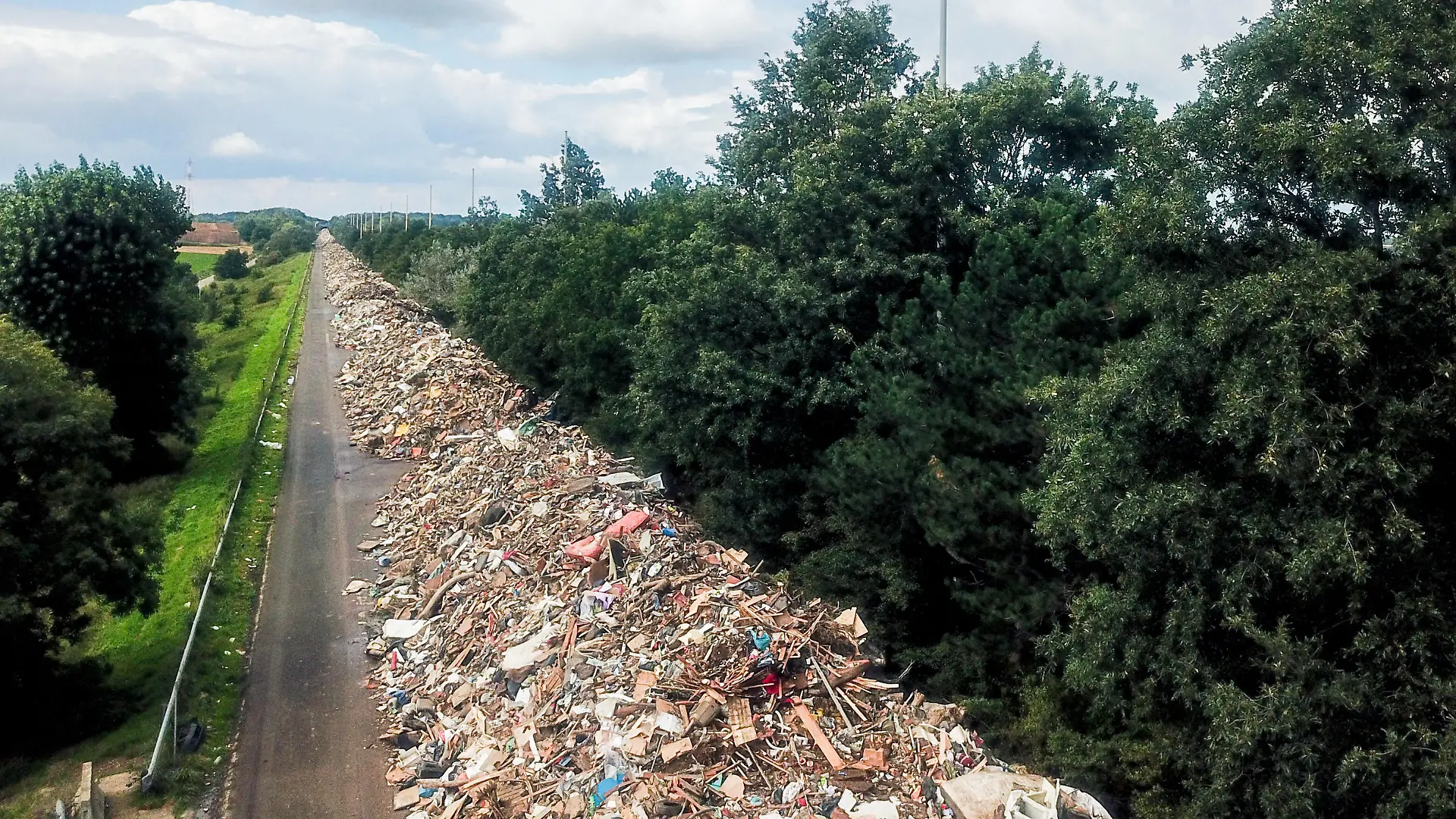 An arm of a disused motorway near Liege collects mountains of waste from the floods of mid-July. Mountains of waste are piling up disproportionately in all the valleys affected by the centenary floods of 14 and 15 July 2021 in the Liege region, Belgium, on August 28, 2021. Photo by Philippe Bourguet/ BePress/ABACAPRESS.COM