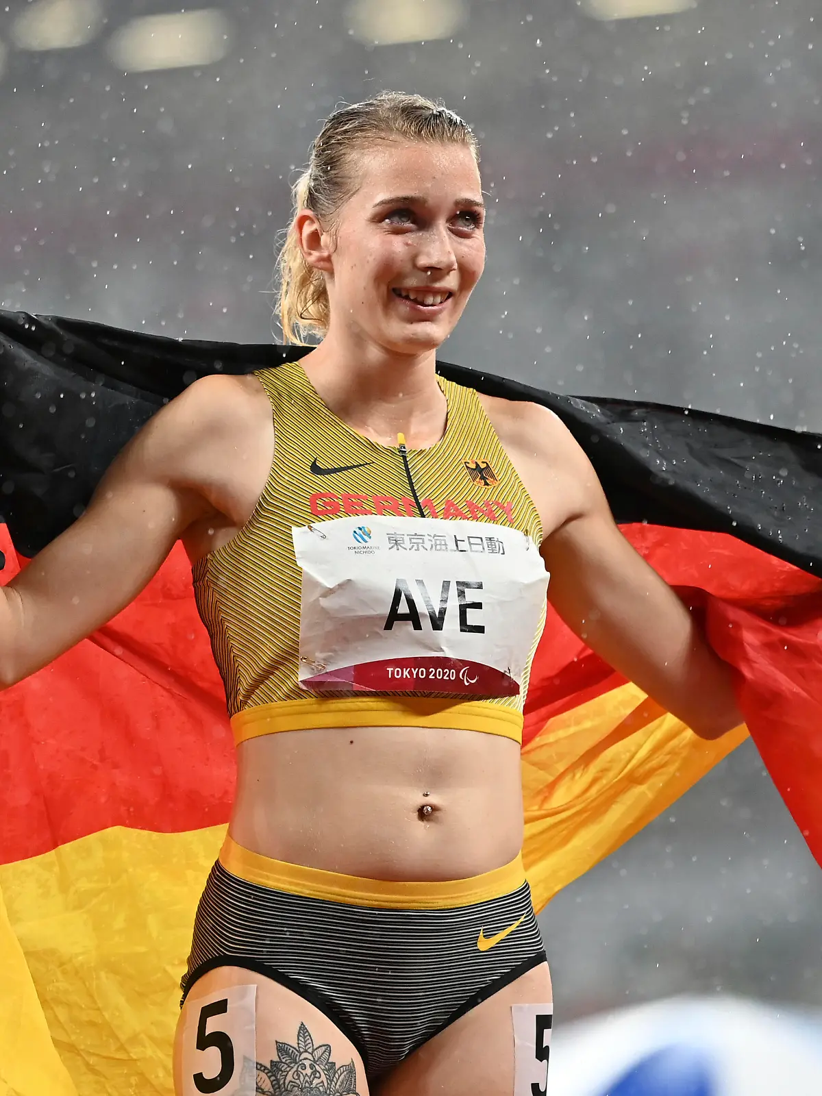 Germany's AVE Lindy poses for a photo after winning the Women's 400m - T38 at the Summer Paralympic Games in Tokyo on Sep. 4, 2021. ( The Yomiuri Shimbun via AP Images )