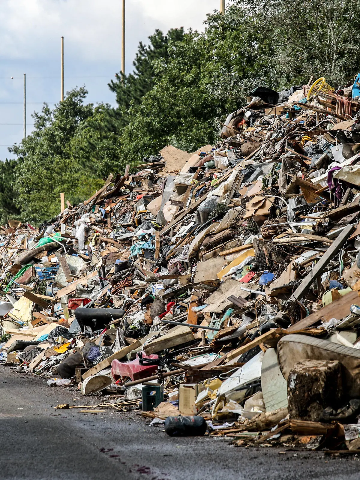 An arm of a disused motorway near Liege collects mountains of waste from the floods of mid-July. Mountains of waste are piling up disproportionately in all the valleys affected by the centenary floods of 14 and 15 July 2021 in the Liege region, Belgium, on August 28, 2021. Photo by Philippe Bourguet/ BePress/ABACAPRESS.COM