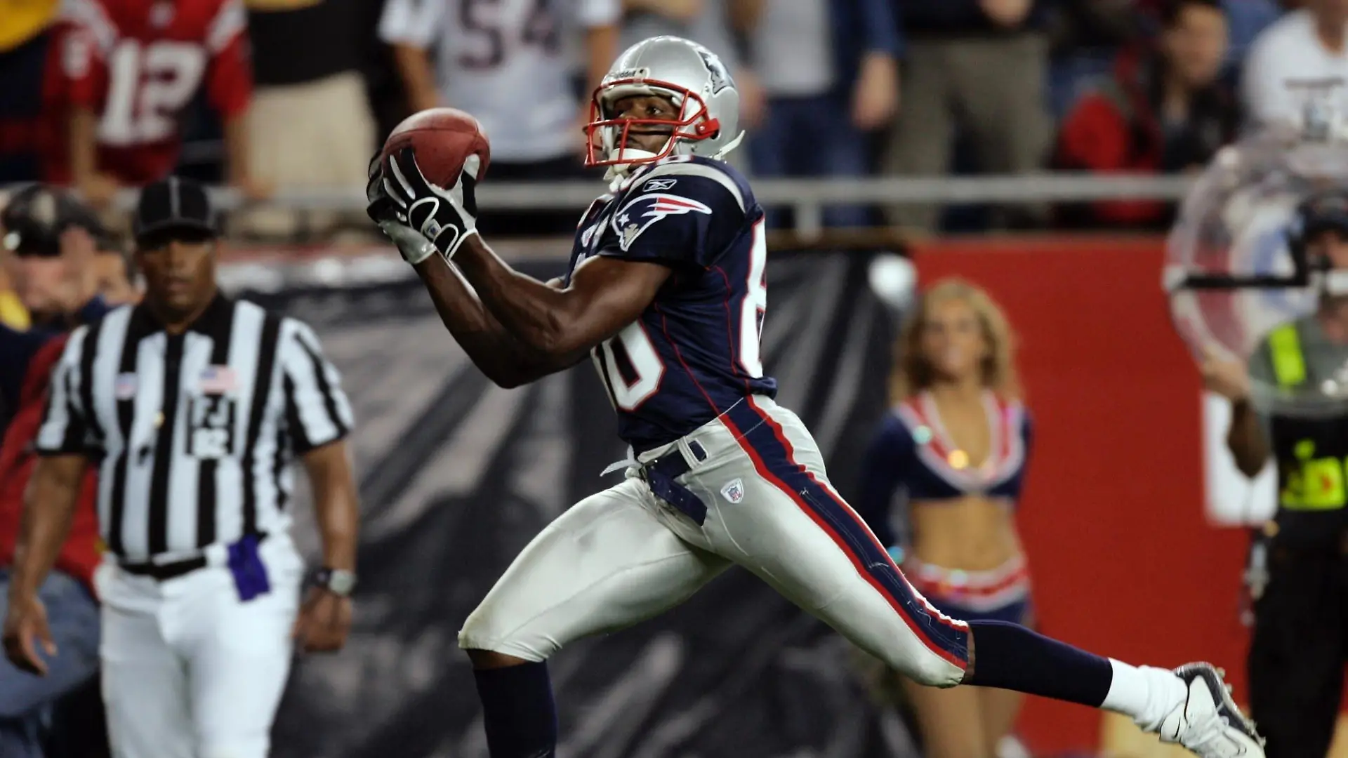 New England Patriots wide receiver David Patten scores on a 25-yard reception from Patriots quarterback Tom Brady during the third quarter against the Indianapolis Colts in Foxboro, Mass. Thursday, Sept. 9, 2004. (AP Photo/Stephan Savoia)