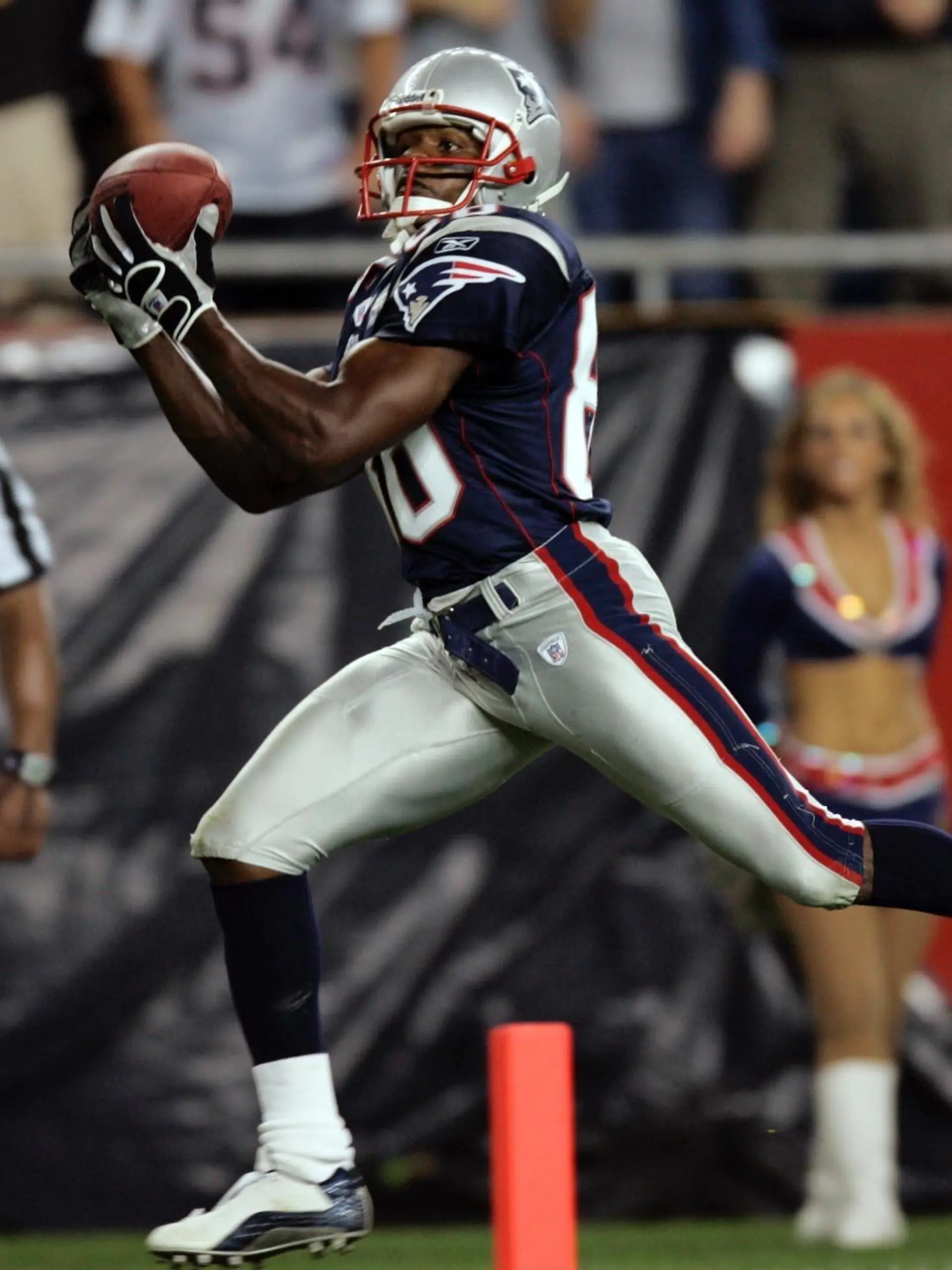 New England Patriots wide receiver David Patten scores on a 25-yard reception from Patriots quarterback Tom Brady during the third quarter against the Indianapolis Colts in Foxboro, Mass. Thursday, Sept. 9, 2004. (AP Photo/Stephan Savoia)
