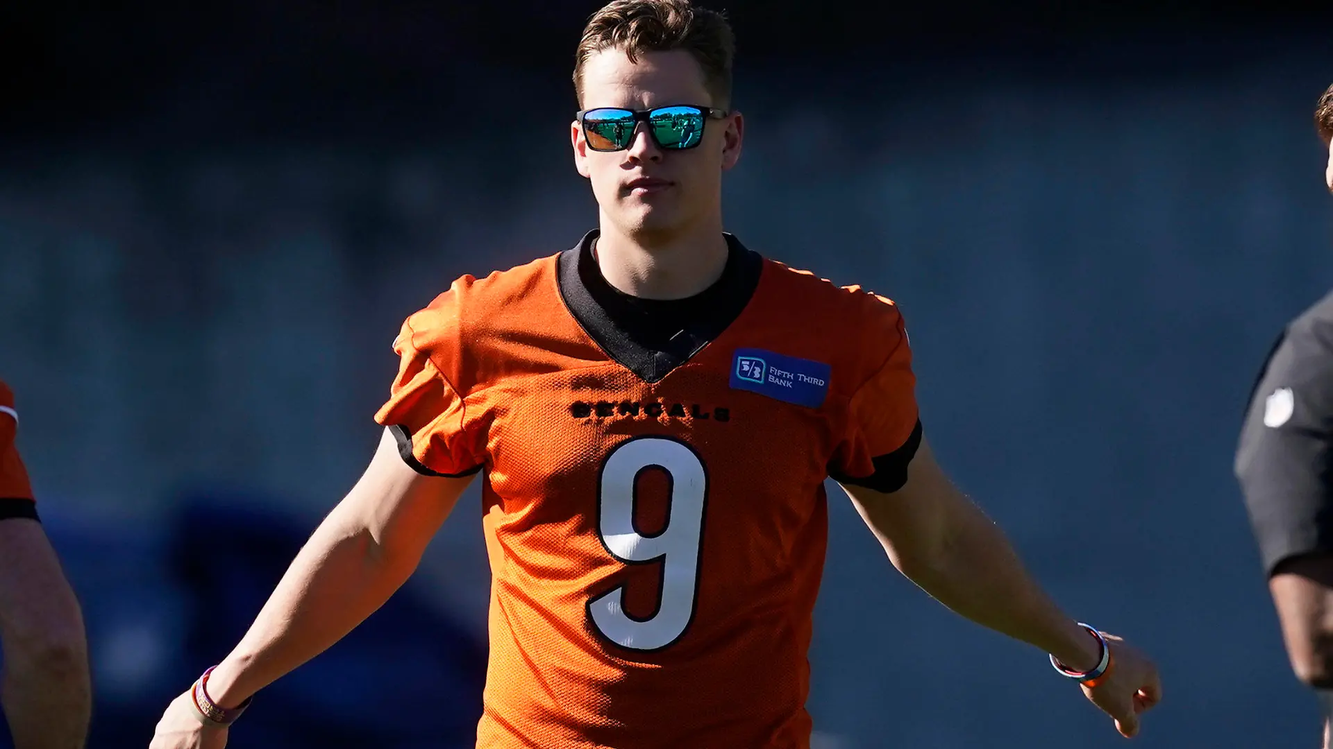 Cincinnati Bengals quarterback Joe Burrow (9) stretches during a walk through in an NFL football practice Saturday, Feb. 12, 2022, in Los Angeles. The Cincinnati Bengals play the Los Angeles Rams in the Super Bowl Sunday Feb. 13. (AP Photo/Marcio Jose Sanchez)