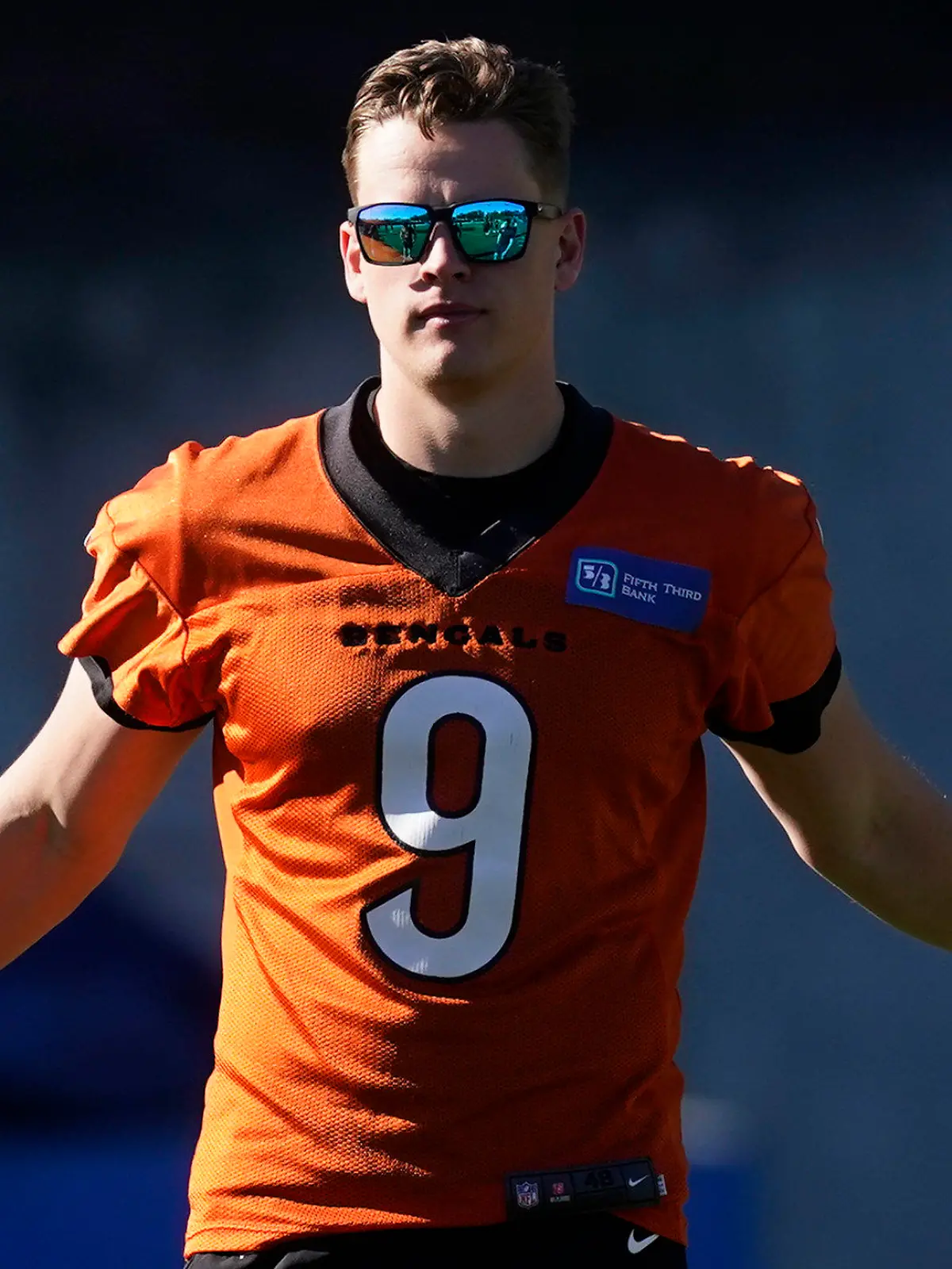 Cincinnati Bengals quarterback Joe Burrow (9) stretches during a walk through in an NFL football practice Saturday, Feb. 12, 2022, in Los Angeles. The Cincinnati Bengals play the Los Angeles Rams in the Super Bowl Sunday Feb. 13. (AP Photo/Marcio Jose Sanchez)