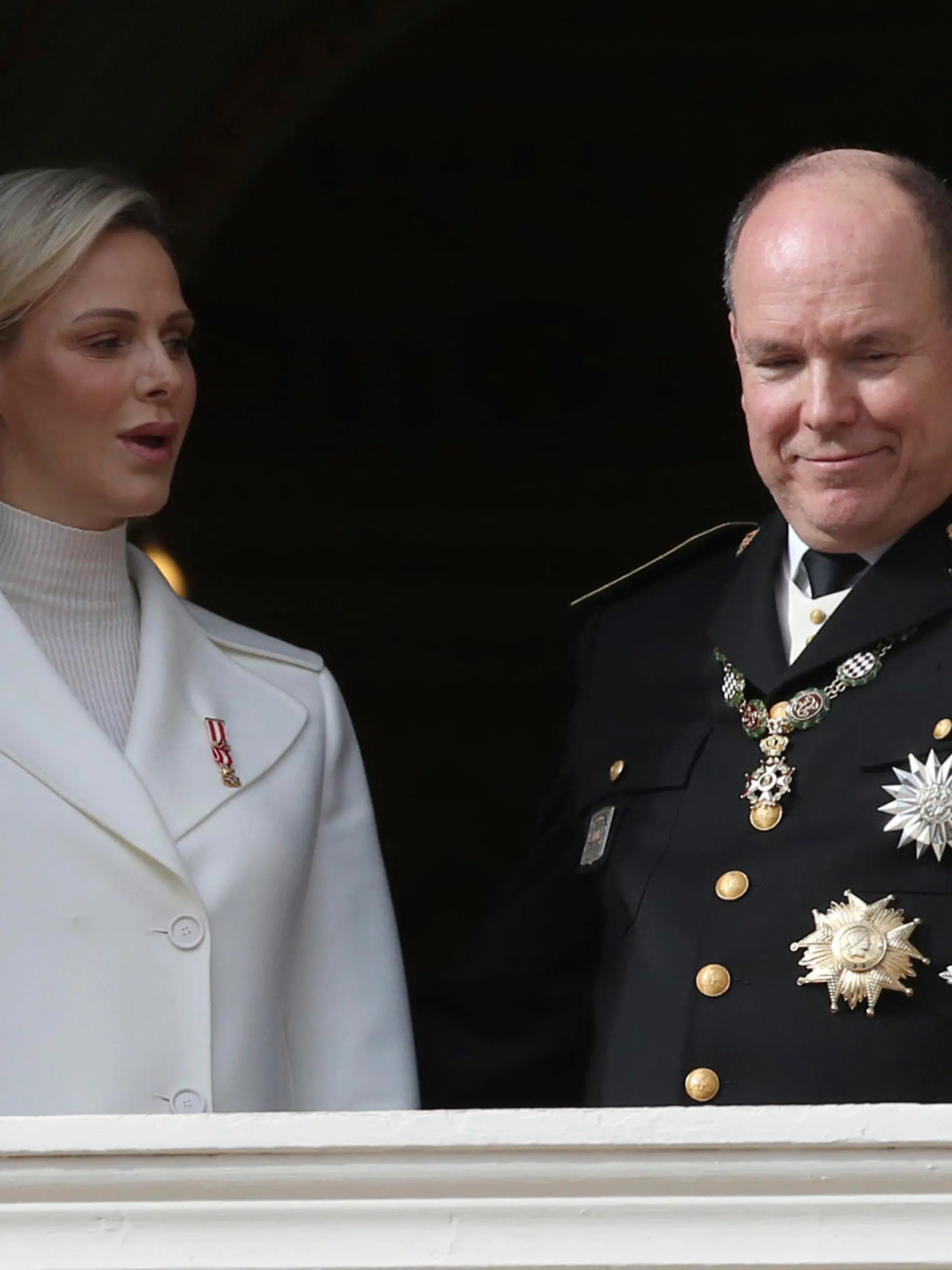 FILE - In this Nov.19, 2019 file photo Prince Albert II of Monaco with his wife Princess Charlene wave from the balcony during the ceremony marking the National Day in Monaco. The palace of Monaco says Prince Albert II has tested positive for the new coronavirus but his health is not worrying. For most people, the new coronavirus causes only mild or moderate symptoms. For some it can cause more severe illness. (AP Photo/Daniel Cole, File)