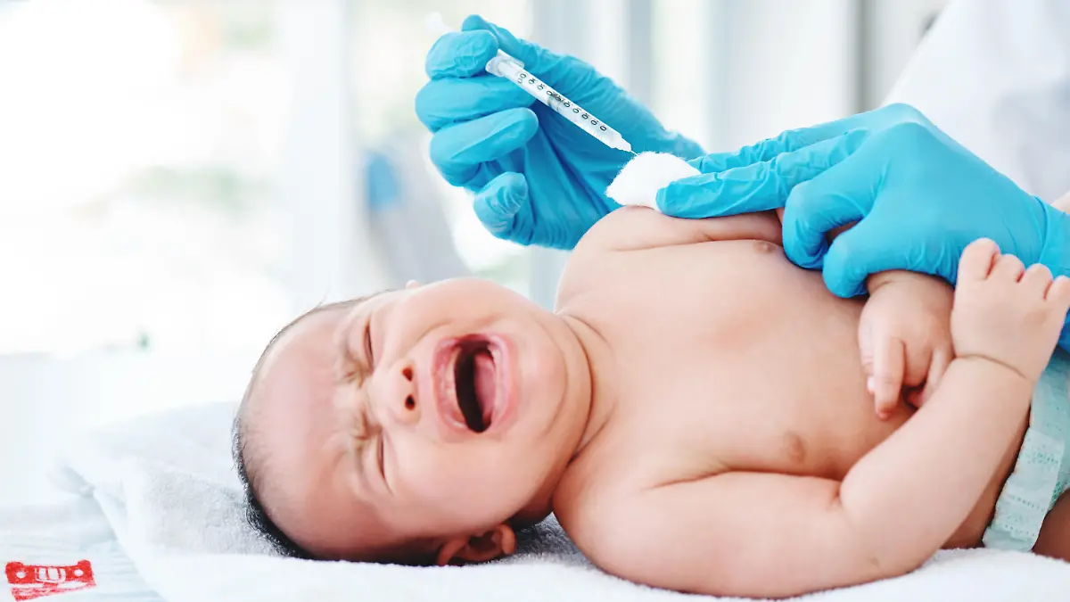 Cropped shot of a doctor giving a newborn baby boy an injection