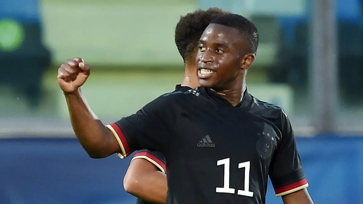 SERRAVALLE, ITALY - SEPTEMBER 02:  Youssoufa Moukoko of U21 Germany celebrates after scoring goal 0-3 during the UEFA European Under-21 Championship Qualifier match between U21 San Marino and U21 Germany at Olimpico di Serravalle on September 2, 2021 in Serravalle, Italy.  (Photo by Giuseppe Bellini/Getty Images)