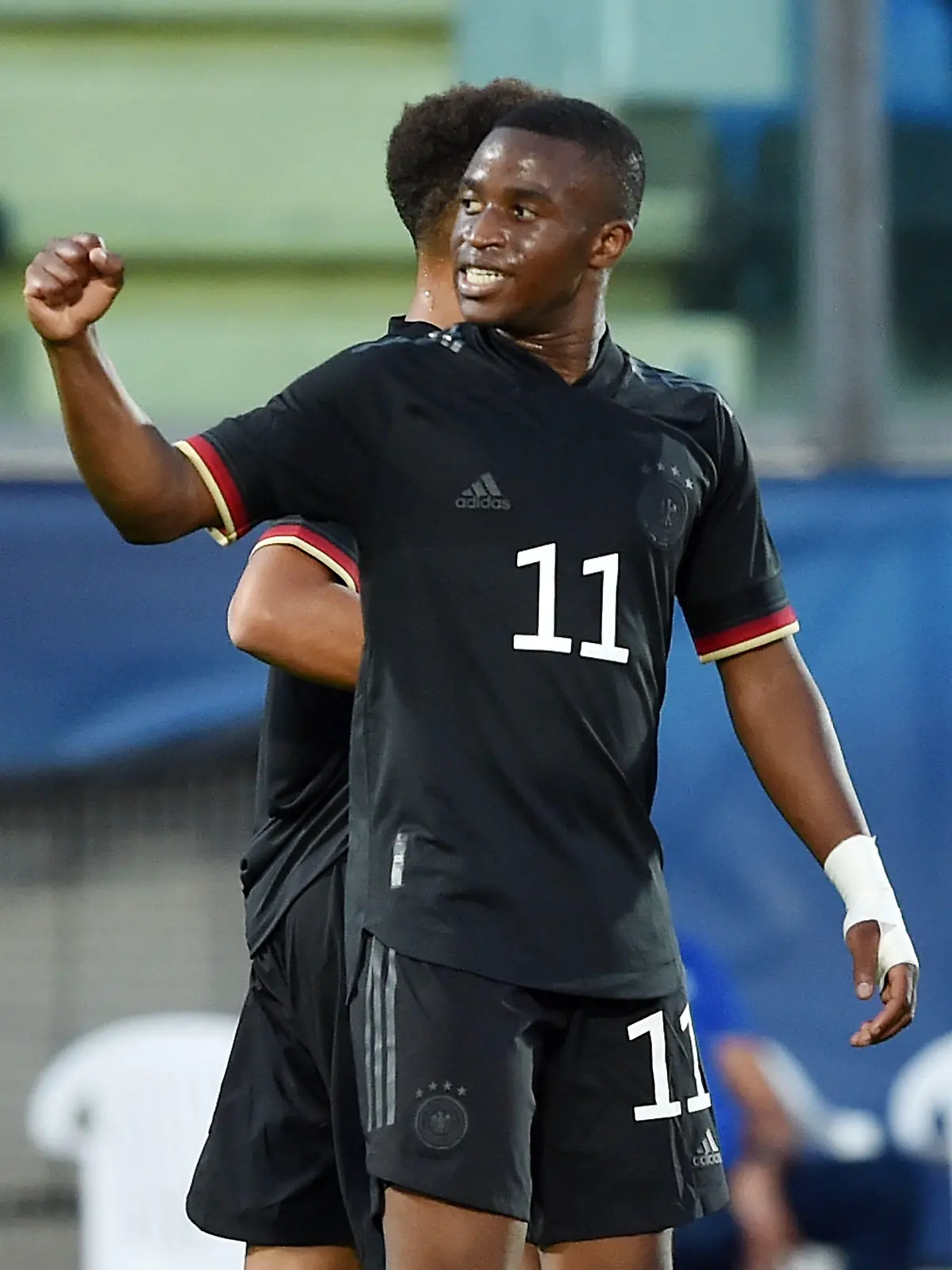 SERRAVALLE, ITALY - SEPTEMBER 02:  Youssoufa Moukoko of U21 Germany celebrates after scoring goal 0-3 during the UEFA European Under-21 Championship Qualifier match between U21 San Marino and U21 Germany at Olimpico di Serravalle on September 2, 2021 in Serravalle, Italy.  (Photo by Giuseppe Bellini/Getty Images)