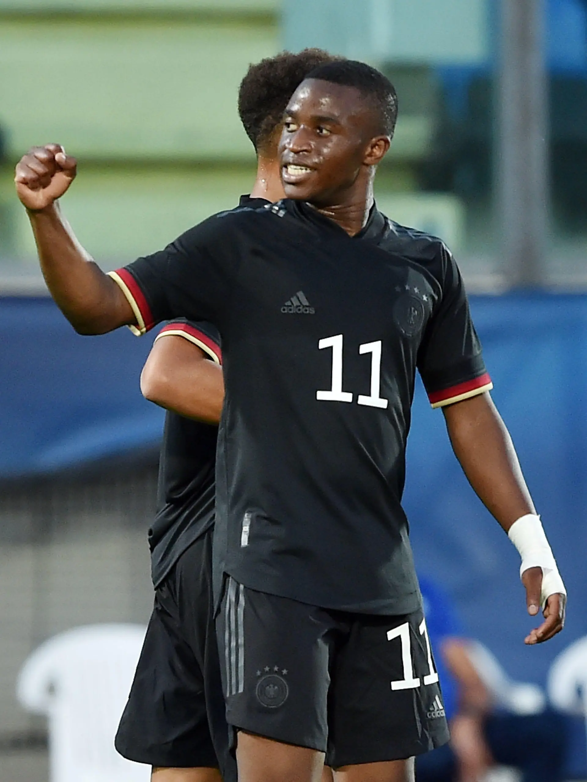 SERRAVALLE, ITALY - SEPTEMBER 02:  Youssoufa Moukoko of U21 Germany celebrates after scoring goal 0-3 during the UEFA European Under-21 Championship Qualifier match between U21 San Marino and U21 Germany at Olimpico di Serravalle on September 2, 2021 in Serravalle, Italy.  (Photo by Giuseppe Bellini/Getty Images)