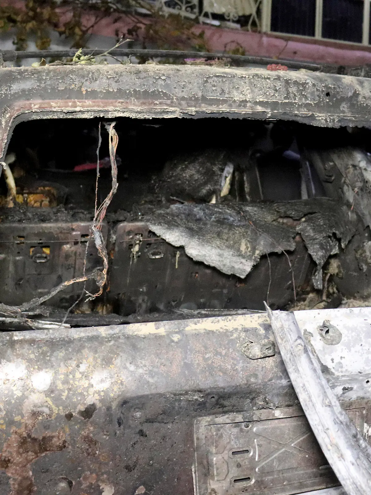 A destroyed vehicle is seen inside a house after a U.S. drone strike in Kabul, Afghanistan, Sunday, Aug. 29, 2021. A U.S. drone strike destroyed a vehicle carrying "multiple suicide bombers" from Afghanistan's Islamic State affiliate on Sunday before they could attack the ongoing military evacuation at Kabul's international airport, American officials said. (AP Photo/Khwaja Tawfiq Sediqi)