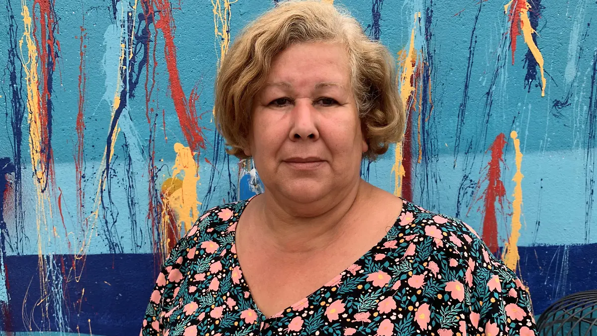Jeanne Pouchain poses during an interview with Reuters at her home, detailing the ordeal she has been leaving through since being declared dead by a judge, in Saint-Joseph, near Lyon, August 30, 2021. Picture taken August 30, 2021. REUTERS/Cecile Mantovani