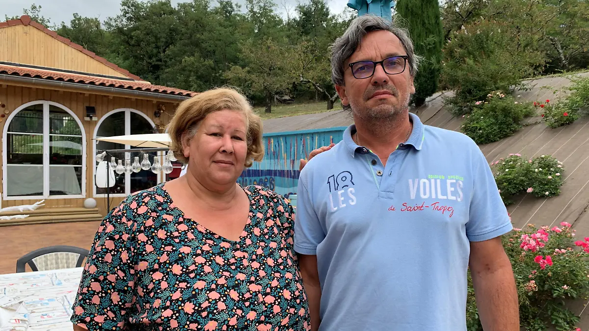 Jeanne Pouchain poses with her husband Pierre-Jean Pouchain during an interview with Reuters at her home, detailing the ordeal she has been leaving through since being declared dead by a judge, in Saint-Joseph, near Lyon, August 30, 2021. Picture taken August 30, 2021. REUTERS/Cecile Mantovani