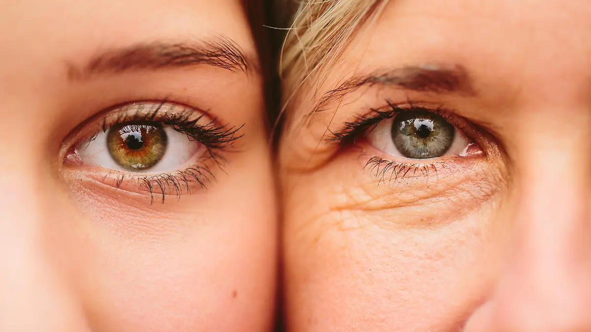 Close up on eyes of mother and daughter faces next to one another