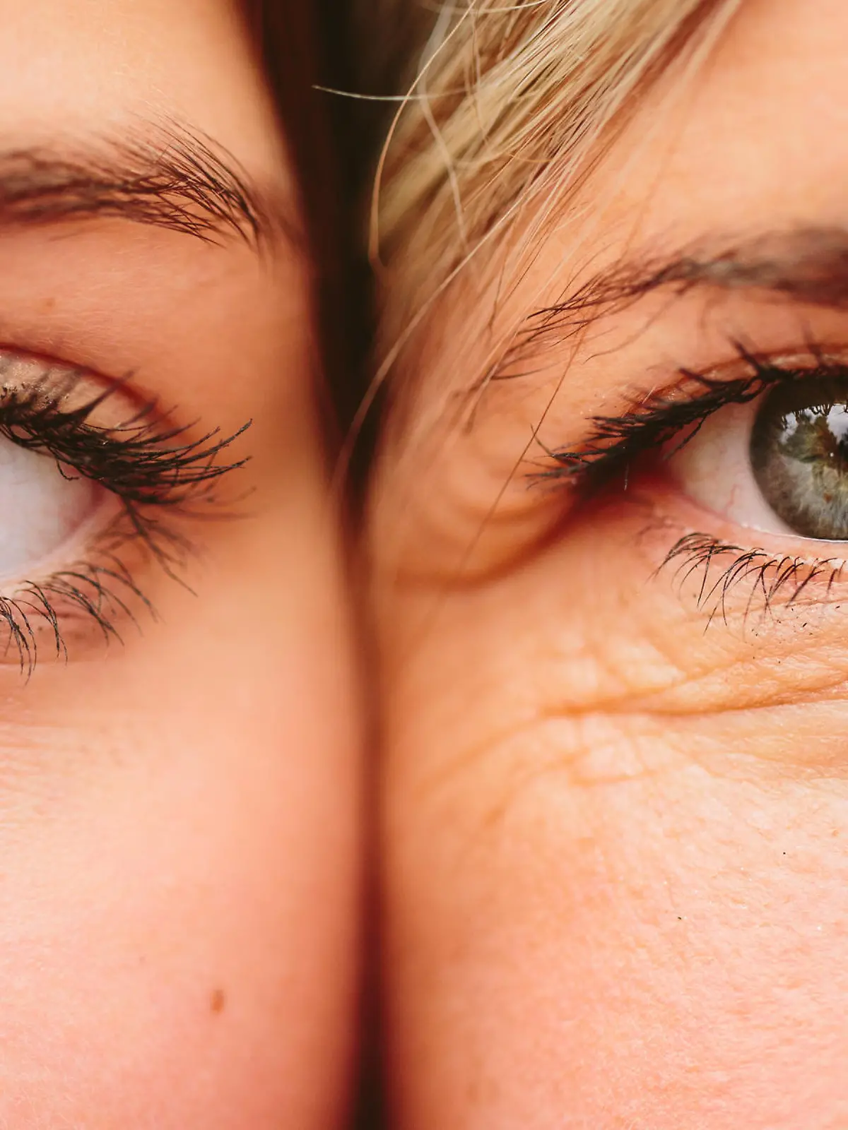 Close up on eyes of mother and daughter faces next to one another