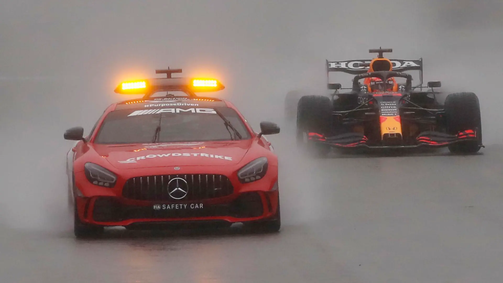 Formula One F1 - Belgian Grand Prix - Spa-Francorchamps, Spa, Belgium - August 29, 2021 General view of the safety car followed by Red Bull's Max Verstappen REUTERS/Christian Hartmann