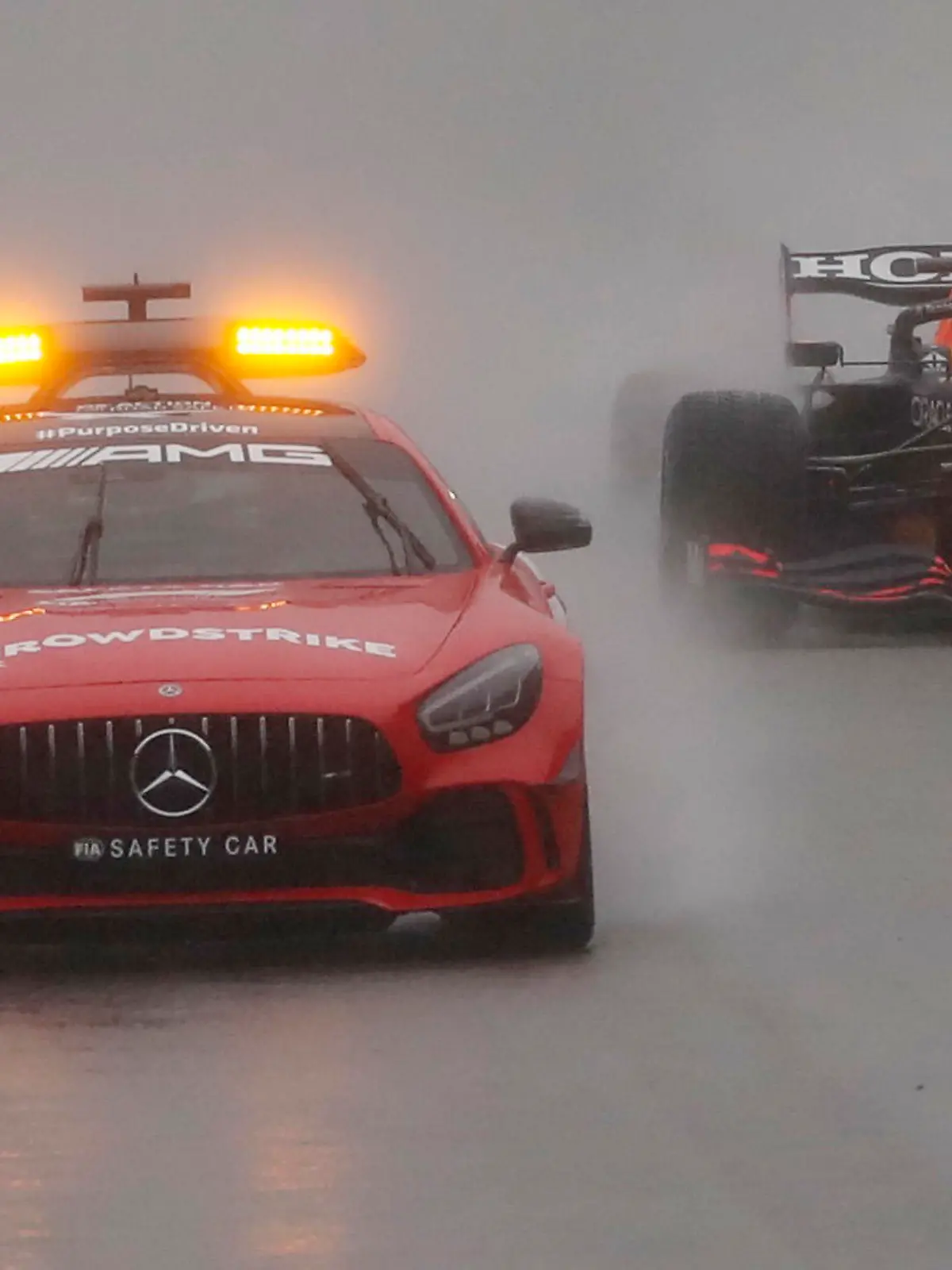 Formula One F1 - Belgian Grand Prix - Spa-Francorchamps, Spa, Belgium - August 29, 2021 General view of the safety car followed by Red Bull's Max Verstappen REUTERS/Christian Hartmann