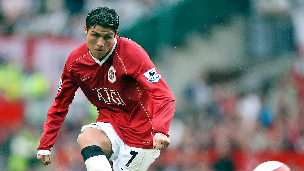 FILE - In this Oct. 1, 2006, file photo, Manchester United's Cristiano Ronaldo fires in a free kick against Newcastle during their English Premier League soccer match at Old Trafford Stadium, Manchester, England. Ronaldo is headed back to Manchester United. The English club said Friday, Aug. 27, 2021, it has reached an agreement with Juventus for the transfer of the 36-year-old Portugal forward, subject to agreement of personal terms, visa and a medical examination. (AP Photo/Jon Super, File)