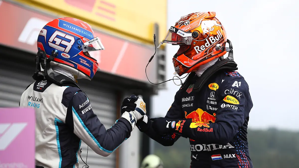 SPA, BELGIUM - AUGUST 28: Pole position qualifier Max Verstappen of Netherlands and Red Bull Racing and second place qualifier George Russell of Great Britain and Williams celebrate in parc ferme during qualifying ahead of the F1 Grand Prix of Belgium at Circuit de Spa-Francorchamps on August 28, 2021 in Spa, Belgium. (Photo by Mark Thompson/Getty Images)