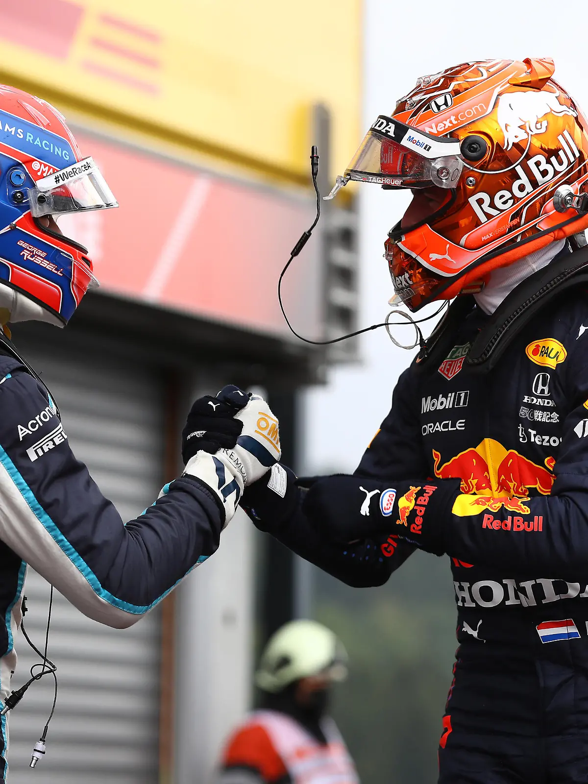 SPA, BELGIUM - AUGUST 28: Pole position qualifier Max Verstappen of Netherlands and Red Bull Racing and second place qualifier George Russell of Great Britain and Williams celebrate in parc ferme during qualifying ahead of the F1 Grand Prix of Belgium at Circuit de Spa-Francorchamps on August 28, 2021 in Spa, Belgium. (Photo by Mark Thompson/Getty Images)
