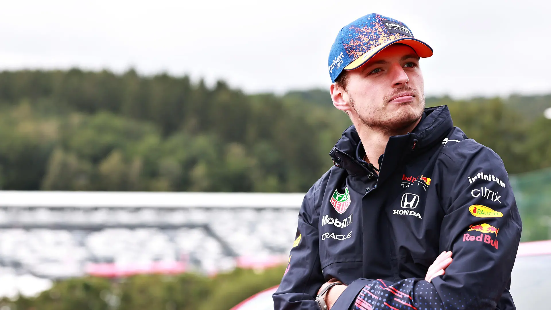 SPA, BELGIUM - AUGUST 26: Max Verstappen of Netherlands and Red Bull Racing looks on in the Paddock during previews ahead of the F1 Grand Prix of Belgium at Circuit de Spa-Francorchamps on August 26, 2021 in Spa, Belgium. (Photo by Mark Thompson/Getty Images)