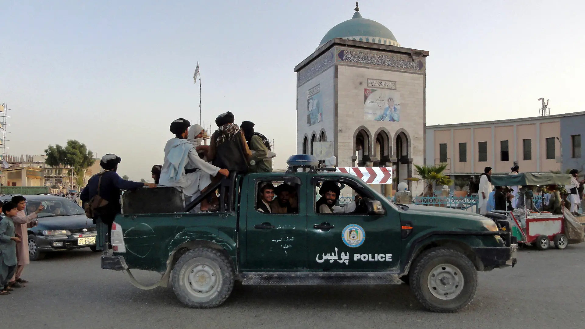 Taliban fighters patrol inside the city of Kandahar, southwest Afghanistan, Sunday, Aug. 15, 2021. (AP Photo/Sidiqullah Khan)