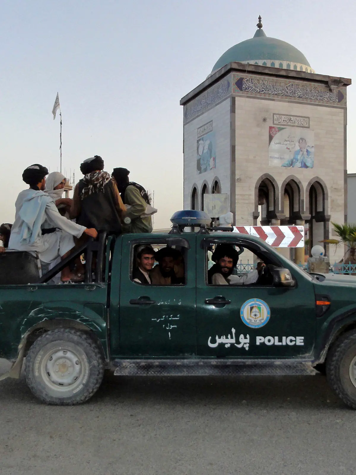 Taliban fighters patrol inside the city of Kandahar, southwest Afghanistan, Sunday, Aug. 15, 2021. (AP Photo/Sidiqullah Khan)