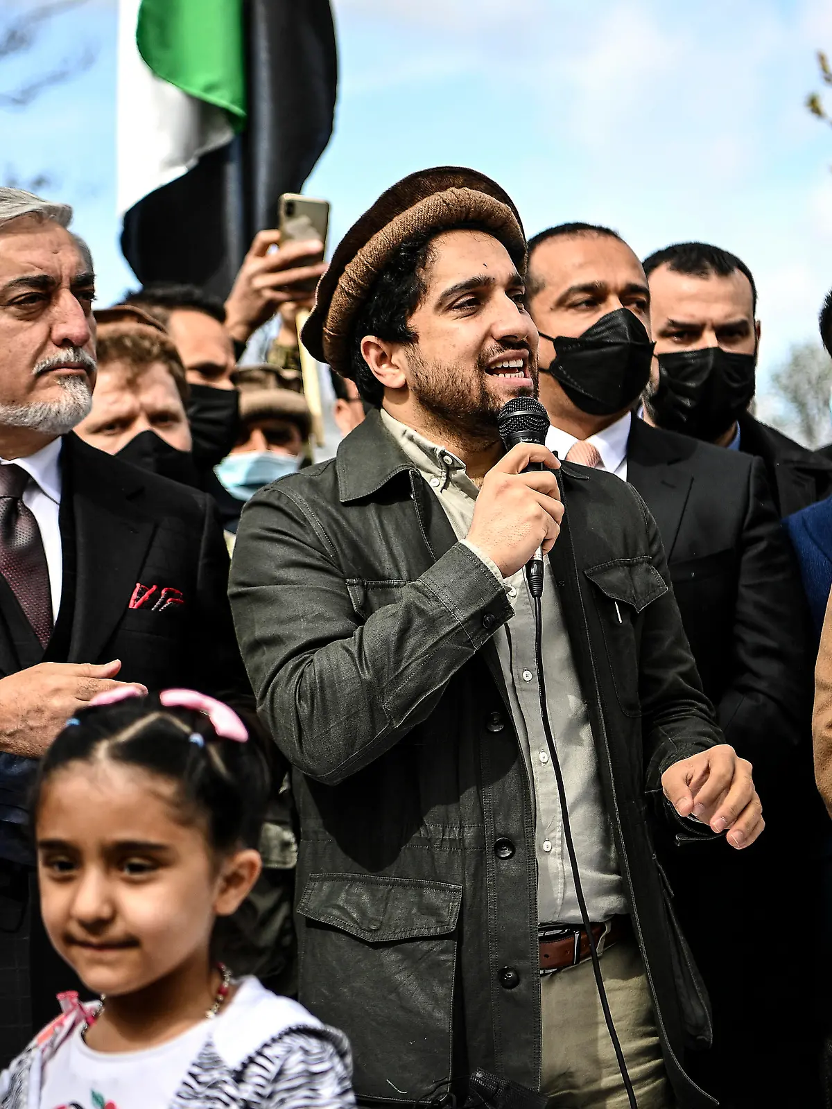 Ahmad Massoud, son of late Afghan commander Ahmad Shah Massoud, center, speaks supporters as he is flanked by Chairman of Afghanistan's High Council for National Reconciliation Abdullah Abdullah, left, and Paris Mayor Anne Hidalgo on the sidelines of a commemoration to honor late Afghan anti-Taliban commander Massoud in an alley along the Champs Elysees Avenue in Paris, Saturday, March 27, 2021. (Christophe Archambault/Pool Photo via AP)