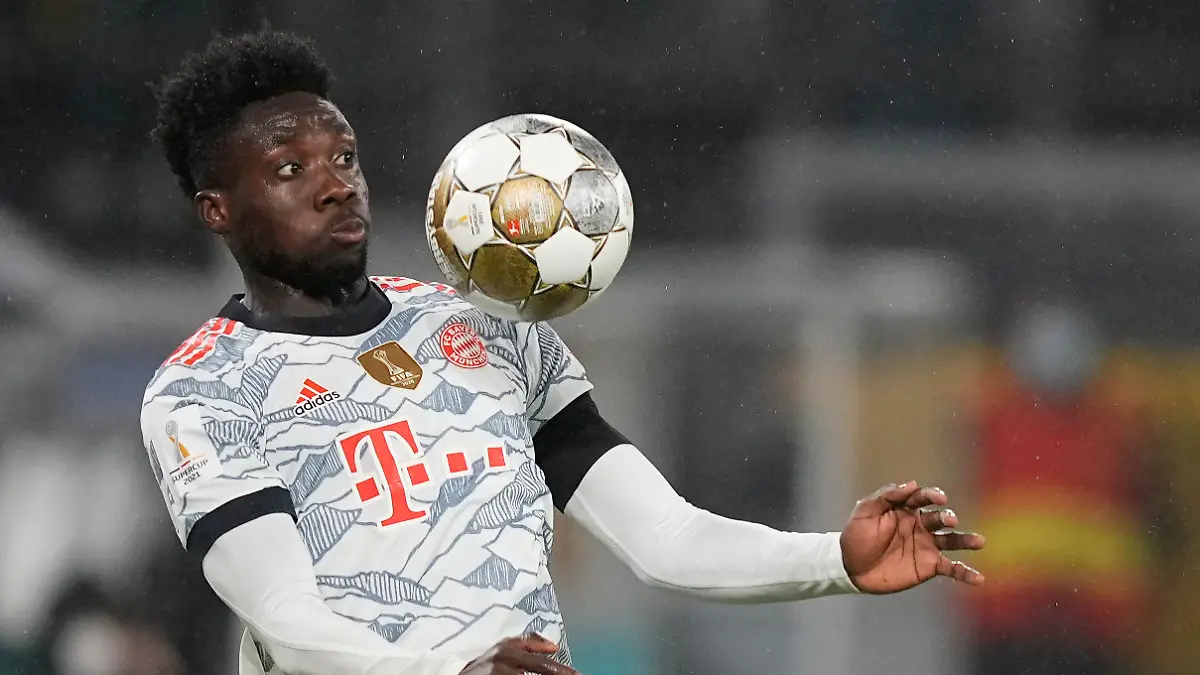 Bayern's Alphonso Davies controls the ball in the air during the German Supercup soccer match between Borussia Dortmund and Bayern Munich in Dortmund, Germany, Tuesday, Aug. 17, 2021. (AP Photo/Martin Meissner)