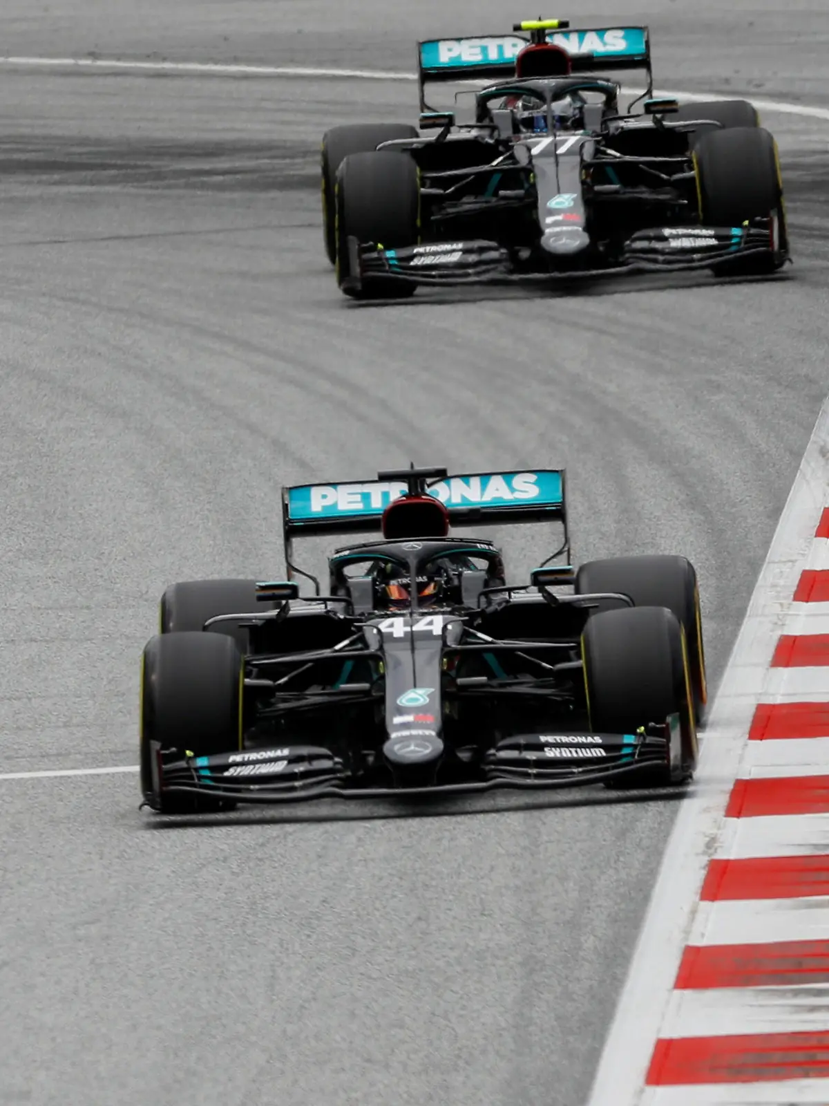 Formula One F1 - Austrian Grand Prix - Red Bull Ring, Spielberg, Styria, Austria - July 3, 2020  Mercedes' Lewis Hamilton and Mercedes' Valtteri Bottas during practice, as F1 resumes following the outbreak of the coronavirus disease (COVID-19)  REUTERS/Leonhard Foeger/Pool