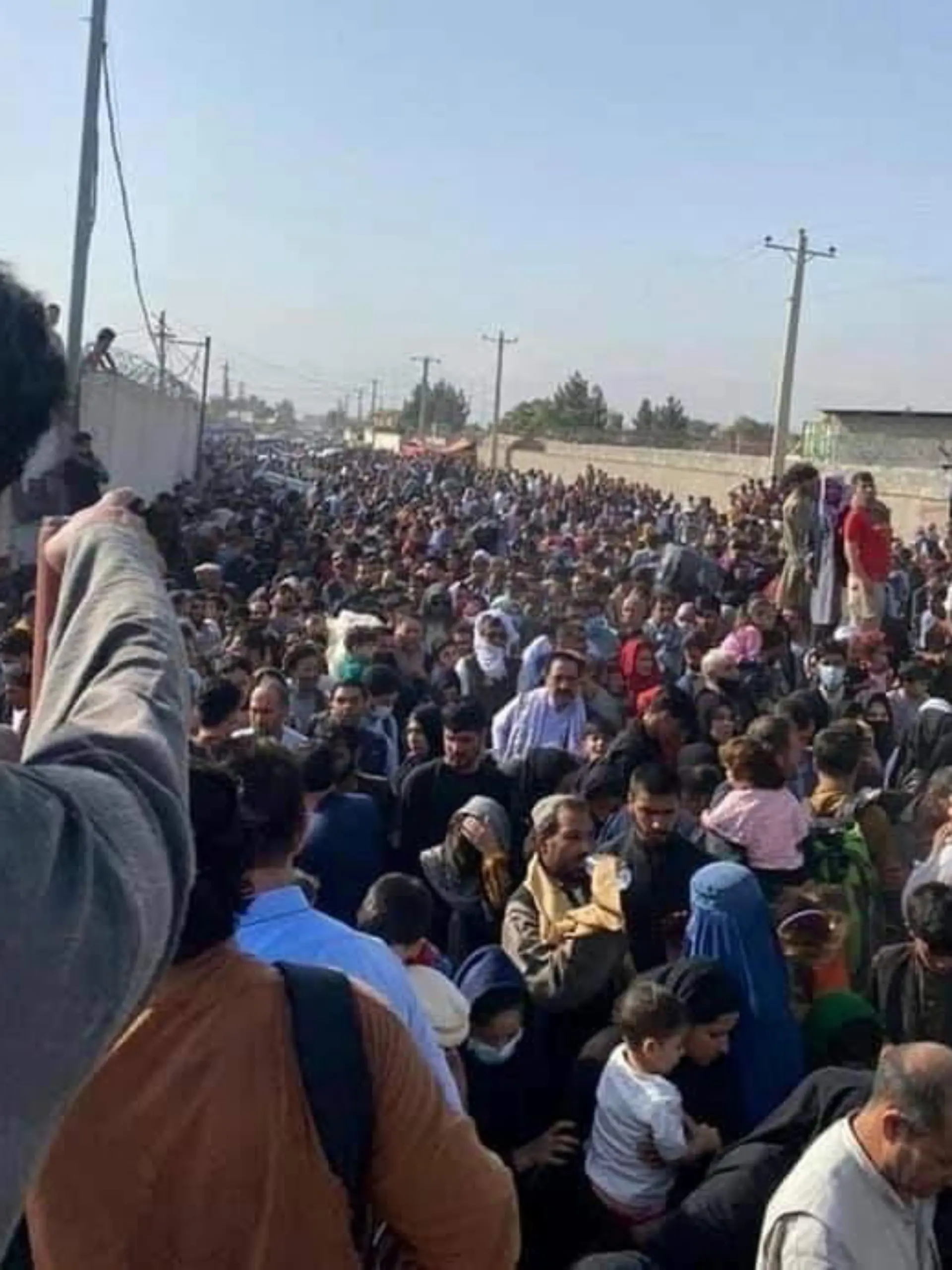 General view showing people near the airport in Kabul, Afghanistan, August 19, 2021, in this picture obtained from social media. Picture taken August 19, 2021. OMAR HAIDARI/via REUTERS ATTENTION EDITORS - THIS IMAGE HAS BEEN SUPPLIED BY A THIRD PARTY. MANDATORY CREDIT.
