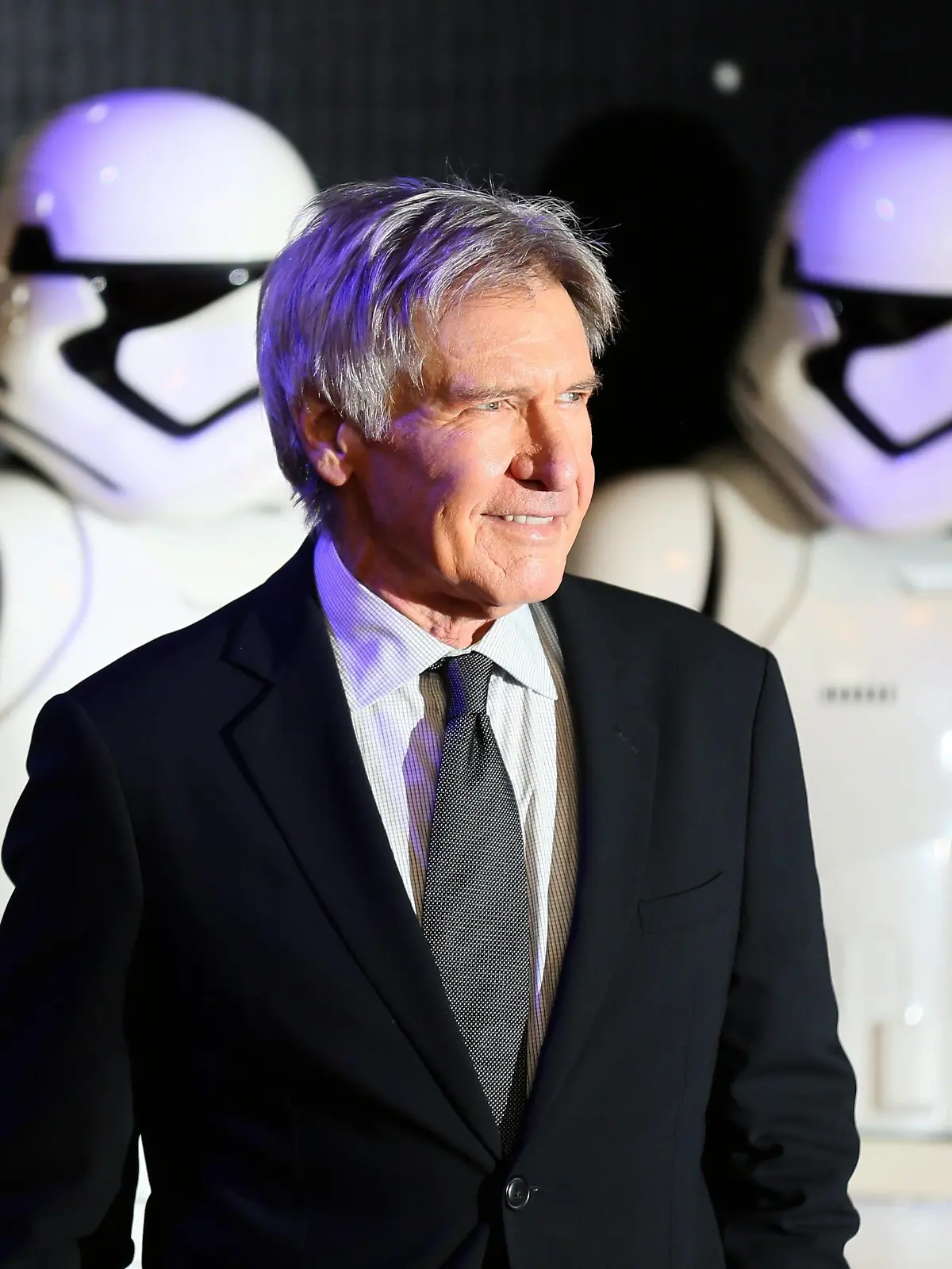 Harrison Ford arrives at the European Premiere of Star Wars, The Force Awakens in Leicester Square, London, in this December 16, 2015, file photo. A production company that was involved in making "Star Wars: The Force Awakens" will face criminal charges over an incident during filming in which Harrison Ford broke his leg, Britain's Health and Safety Executive said on February 11, 2016.   REUTERS/Paul Hackett/Files