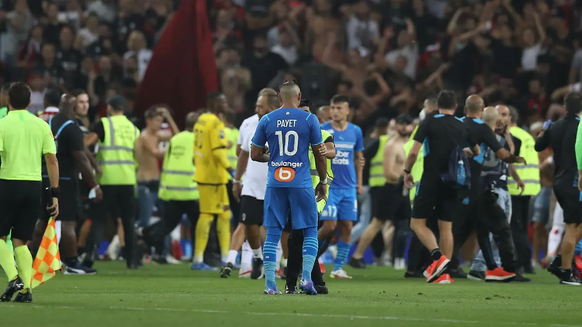 August 22, 2021, Nice, United Kingdom: Nice, France, 22nd August 2021. Fans spill onto the pitch to interrupt the game after the Dimitri Payet of Olympique De Marseille threw an object back into the crown that was intially thrown in his direction during the Lique 1 match at Allianz Riviera Stadium, Nice. Picture credit should read: Jonathan Moscrop / Sportimage Photo via Newscom picture alliance
