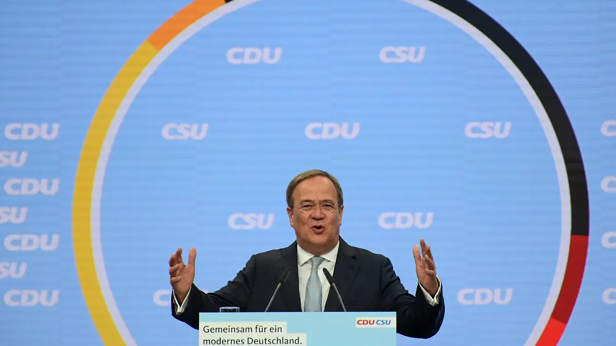 Prime Minister of North Rhine-Westphalia and candidate for chancellor of the CDU/CSU Armin Laschet addresses supporters during a CDU/CSU campaign kick off ahead of the federal election at Tempodrom in Berlin, Germany, August 21, 2021. REUTERS/Annegret Hilse