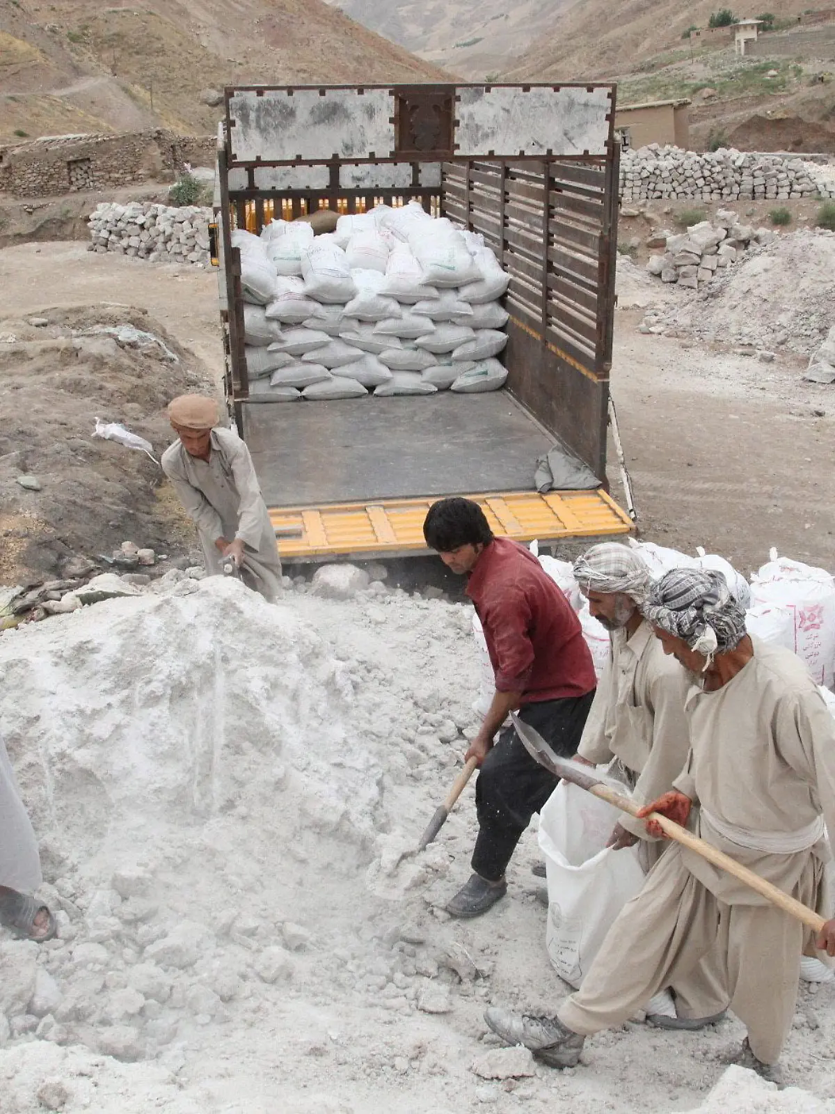 epa03823072 Afghans laborers collect salt from salt mines in Namak Aab district of Takhar province, Afghanistan, 13 August 2013. According to media reports, Afghanistan has nearly one trillion dollars in untouched mineral deposits including lithium, iron, copper, cobalt and gold, referring to US government estimates. The deposits could turn Afghanistan into one of the most important mining centres in the world. However, with almost no mining industry infrastructure in place, it would take Afghanistan decades to fully exploit the mineral reserves. EPA/JAWED KARGAR ++