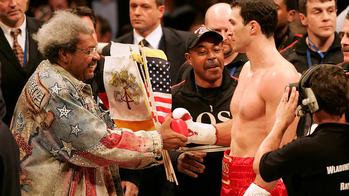MANNHEIM, GERMANY - MARCH 10: Don King congratulates Wladimir Klitschko for his victory after the IBO and IBF World Heavyweight Championship fight between Wladimir Klitschko of Ukraine and Ray Austin of U.S. at the SAP Arena on March 10, 2007 in Mannheim, Germany. (Photo by Alexander Heimann/Bongarts/Getty Images)