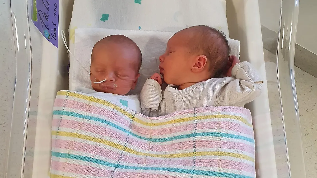 Kimberley Tripp / CATERS NEWS (PICTURED-  The twins in the hospital)  A mum who thought couldn't have kids got more than she bargained for after falling pregnant TWICE in one week – with one baby being conceived through IVF and the other naturally. Ever since she was a little girl, Kimberley Tripp longed to be a mother but after being diagnosed with polycystic ovarian syndrome (PCOS) at 15, she was told she might never be able to have children. But the 34-year-old from Brisbane, Queensland, Australia, said she always held on to a smidgen of hope that her dream of having a family might one day be possible – but after years of trying to conceive naturally, she knew it was time to consider her options. After getting into shape and preparing herself mentally, Kimberley and her husband Adrian spent thousands undergoing four rounds of IVF – and in July 2019, she was overjoyed to discover she was pregnant after having one of her embryos transferred. But little did the office manager know her excitement was about to be doubled, after a doctor's appointment confirmed she was expecting twins – with one being conceived through IVF, and the other naturally, approximately one week apart.  -SEE CATERS COPY
