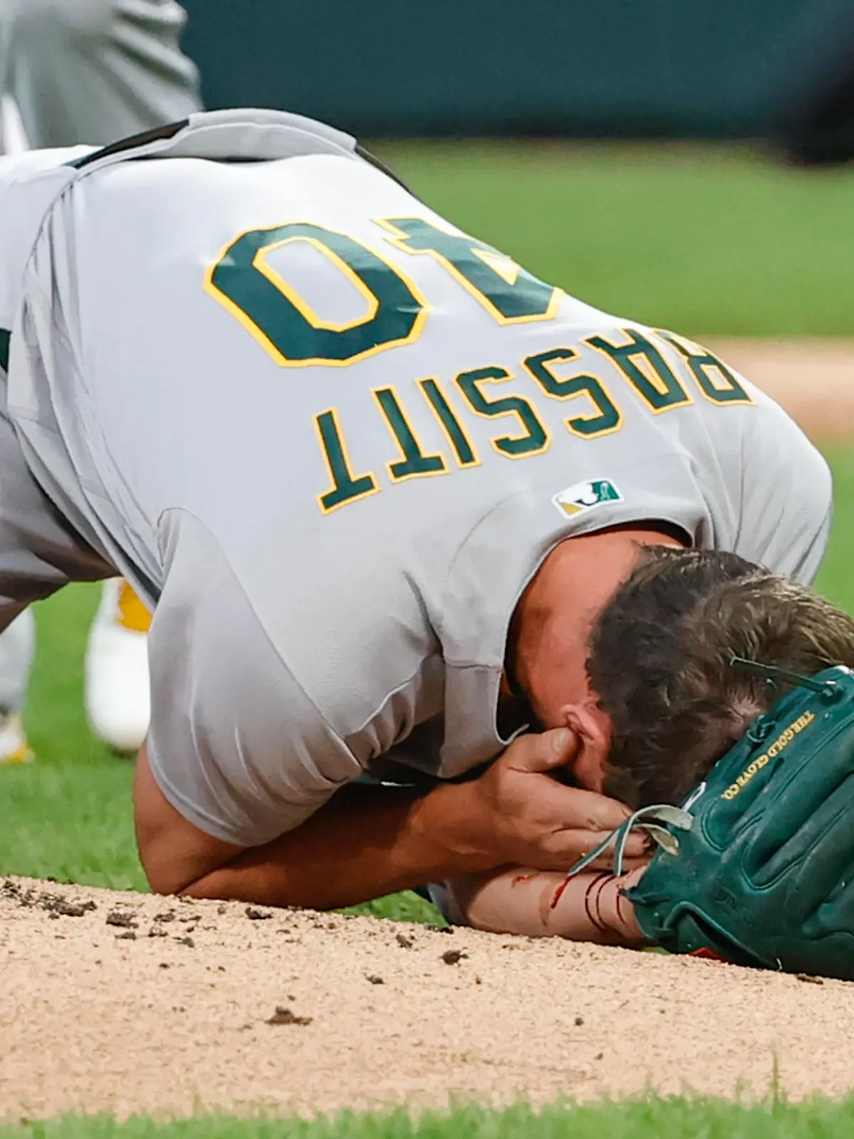 Aug 17, 2021; Chicago, Illinois, USA; (EDITORS NOTE: graphic content) Oakland Athletics starting pitcher Chris Bassitt (40) covers his face after being hit by a ball hit by Chicago White Sox left fielder Brian Goodwin during the second inning at Guaranteed Rate Field. Mandatory Credit: Kamil Krzaczynski-USA TODAY Sports