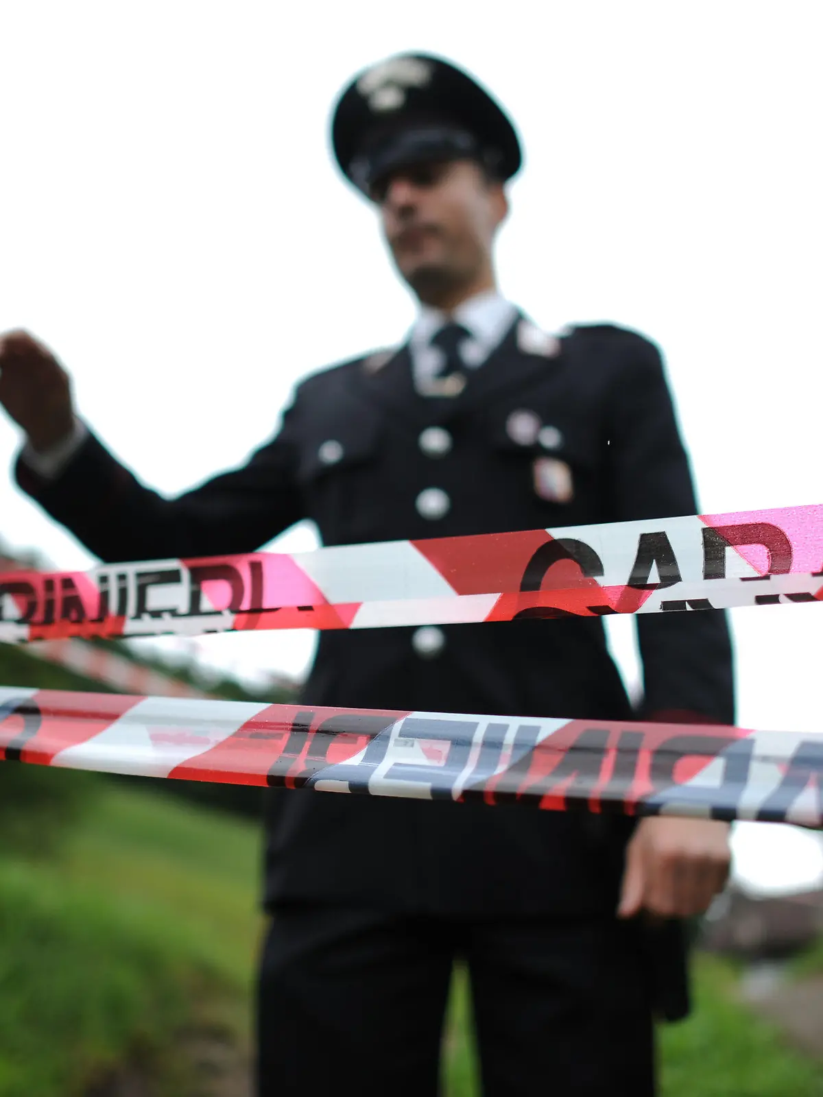 An Italian police officer stands guard near the site where supposedly a car accident happened during a joint presentation of German Football Association DFB and it's general sponsor Mercedes in St. Leonhard in Passeier, Italy, 27 May 2014. Germany's national soccer squad prepares for the upcoming FIFA World Cup 2014 in Brazil at a training camp in South Tyrol until 30 May 2014. Photo: Andreas Gebert/dpa +++(c) dpa - Bildfunk+++