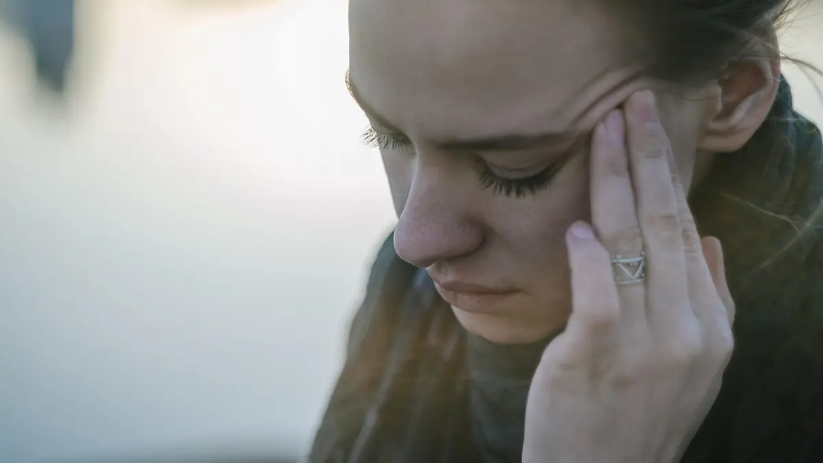 Young woman with sinus pressure pain. Depressing state concept